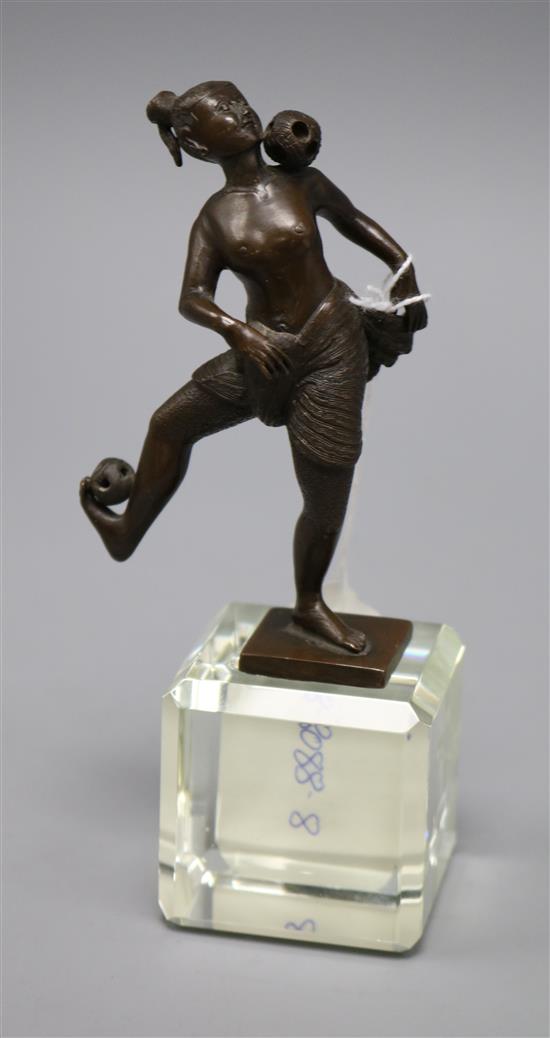 An Indonesian bronze figure of a juggler, on perspex base overall height 16cm